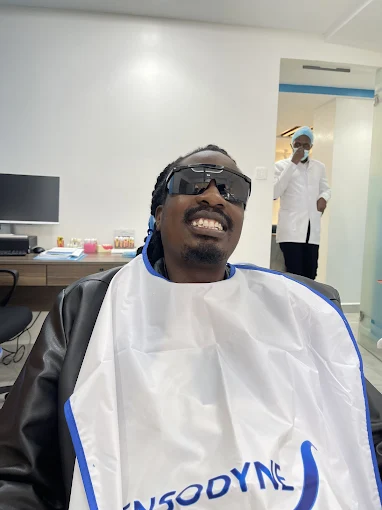 Happy patient smiling after dental treatment at DentMind CBD Dental Centre Nairobi CBD