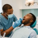 Dentist assessing a patient before a frenectomy in Nairobi CBD at DentMind CBD Dental Centre.