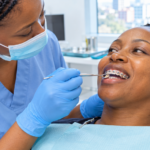 Adult patient with braces having gums checked by a dentist in Nairobi CBD.